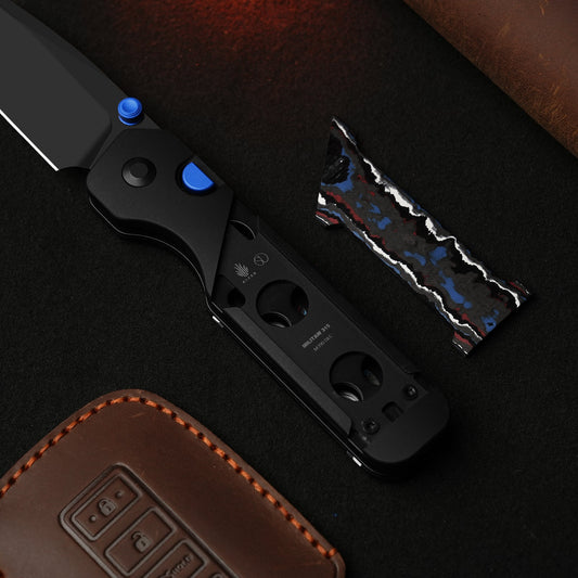 Kizer Militaw M390 DLC folder on dark surface with leather key case